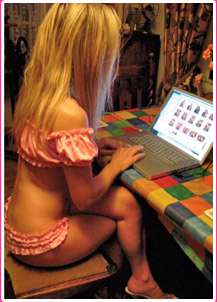 porn star naughty tinkerbell at computer desk talking to members
